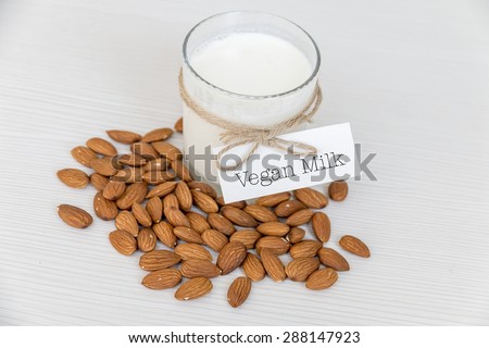 Vegan Organic Meal - Almond Milk. Almond Nuts with Glass of Nut Milk. Healthy Food Concept.