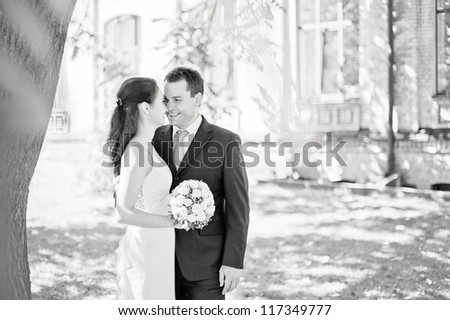 black and white outdoor portrait of young couple in love