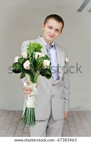 man presents flowers