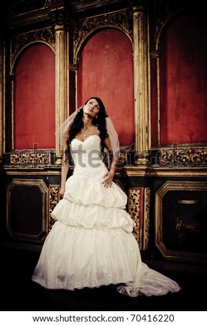 beautiful girl in a wedding dress standing in a church