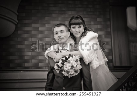 close up black and white photo of happy attractive bride and groom