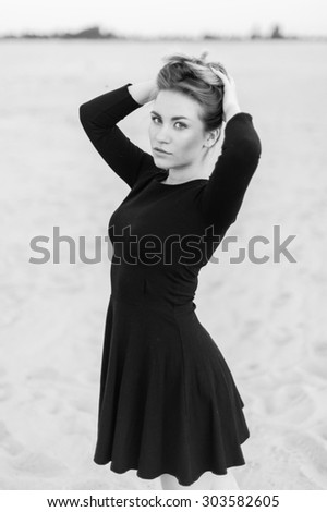 close-up portrait of a beautiful young woman in black dress