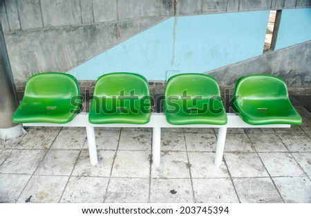 plastic chairs at bus stop