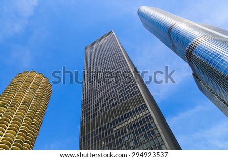 CHICAGO, USA - MAY 24, 2014: Looking up to three skyscrapers in a row. Marina City tower, Trump Tower and AMA Plaza in Downtown Chicago.