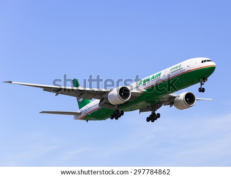 LOS ANGELES, USA - MAY 30, 2015: An airplane of Eva Air (Boeing 777-300ER) landing at Los Angeles International Airport.