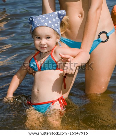 little girl bathe in river