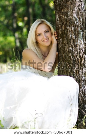 portrait of young beautiful bride in summer outdoor