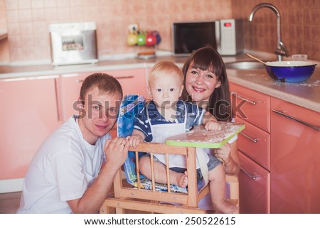 Portrait of happy smiling family at kitchen