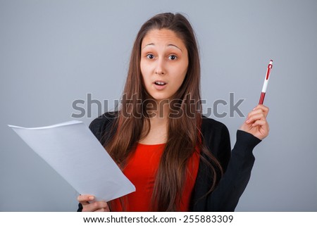 Education, technology and people concept. Curious Girl with paper and pen