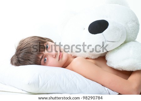 portrait of handsome guy with white bear isolated on white