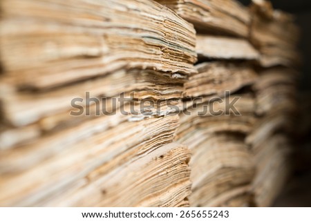 Stack of the old paper documents in the archive.