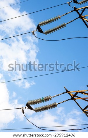 Suspended insulators of the high-voltage electric power transmission.