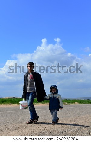 Syrian people in refugee camp in Suruc. These people are refugees from Kobane and escaped because of Islamic state attack. 3.4.2015, Suruc, Turkey