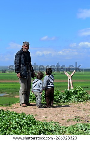 Syrian people in refugee camp in Suruc. These people are refugees from Kobane and escaped because of Islamic state attack. 3.4.2015, Suruc, Turkey