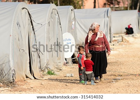 Unnamed  syrian (kurdish) people in refugee camp in Suruc. These people are refugees from Kobane and escaped because of Islamic state attack. April 3, 2015; Suruc, Turkey