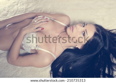 luxury brunette glamor young lady in excellent fitness shape having fun calm relaxing in underwear, looking at camera on light copy space background portrait image