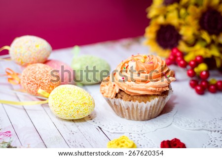Close up image on set of cake, colorful eggs and gift decorations