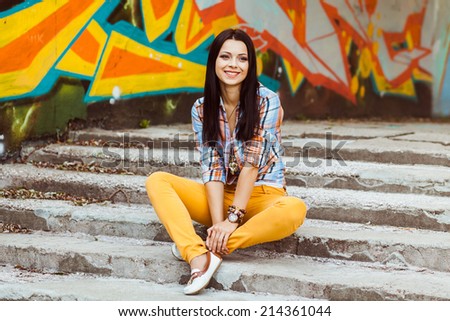 young girl on a background of graffiti