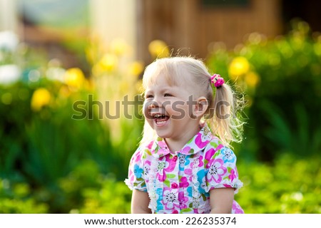 Joyful girl laughing cheerful summer afternoon in nature