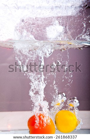 Fruits and vegetables in a spray of water