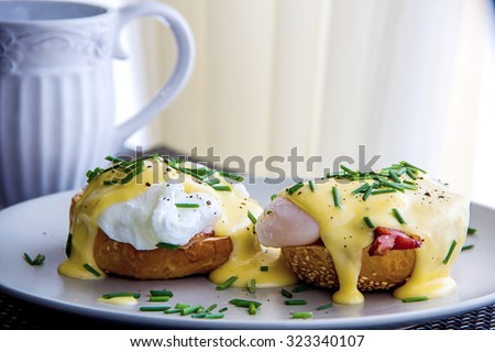 Eggs Benedict- toasted muffins, ham, poached eggs, delicious buttery hollandaise sauce