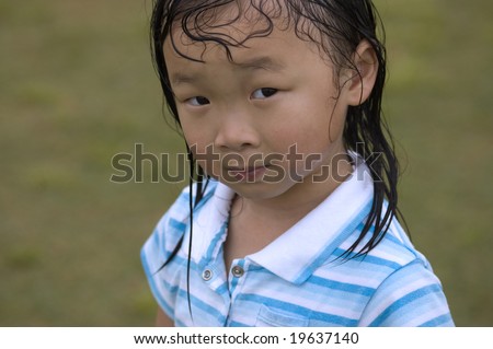 Young Asian girl caught in the rain