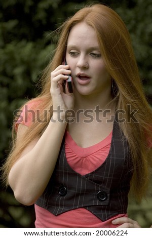 Beautiful red head talking on a cell phone
