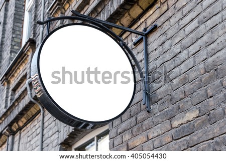 Photo blank white mockup of street store vintage signboard on an old yellow brick wall