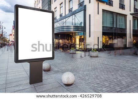 Blank mock up of vertical street ad billboard in busy city street