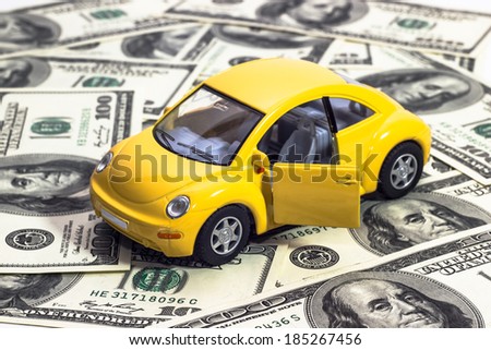 toy car on a background of money