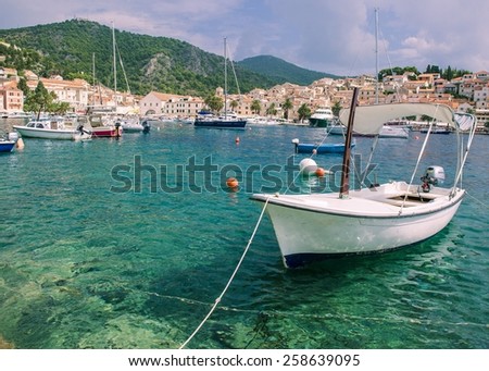 Row fishing boat white ocean harbor sea water ocean green blue mountain calm