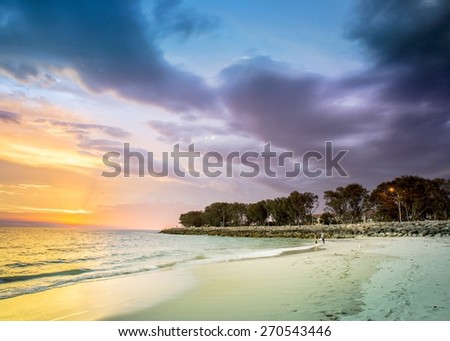 Sunset Australia colorful purple yellow gold blue sky clouds ocean sea water beach storm