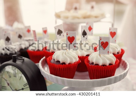 Red velvet cupcakes with playing cards toppers, Alice in wonderland mad hatters tea party