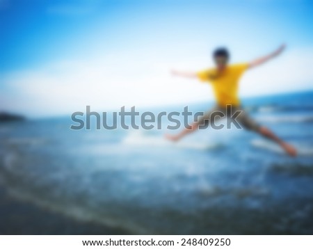 blur landscape and happy man jump