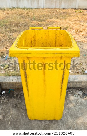 yellow garbage bins