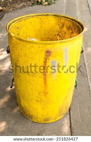 old yellow garbage bins