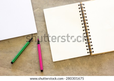Blank stationery set on concrete background for presentation and business / book and color magic pen