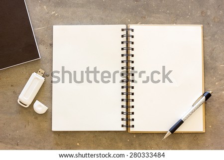 Blank stationery and thumb drive set on concrete background for presentation and business