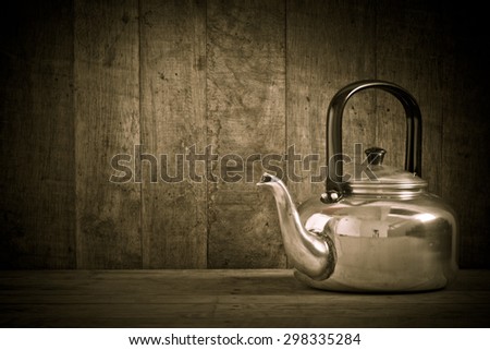 Retro style still life of old aluminium kettle