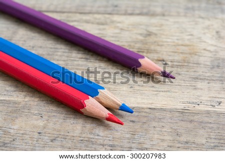 Color pencils on wood background close up ,Color pencils Background texture ,Color pencils red mix blue to purple color,primary color