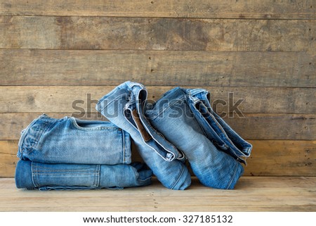 Blue jeans denim on wooden background
