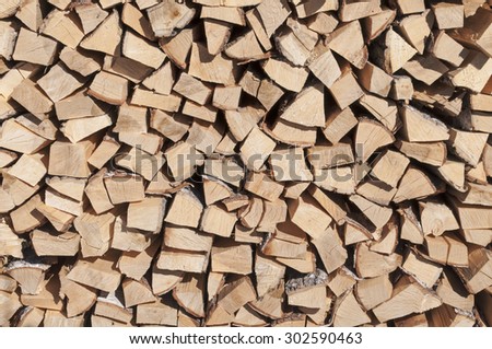 Stack of wood. The stock of firewood. Birch firewood.