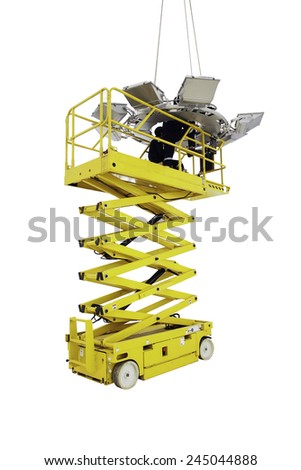 Worker on a Scissor Lift Platform at a working site. Men at work