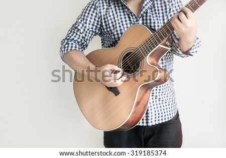 Acoustic Guitar Playing. Men Playing Acoustic Guitar