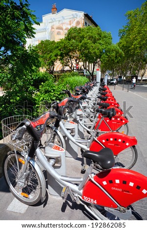 LYON, FRANCE - MAY 26: Station with bicycles for rent on Quai Romain Rolland on May 26, 2012 in Lyon, France.  There are 340 Rental Stations, with a total of 4000 bicycles available for rent in Lyon.