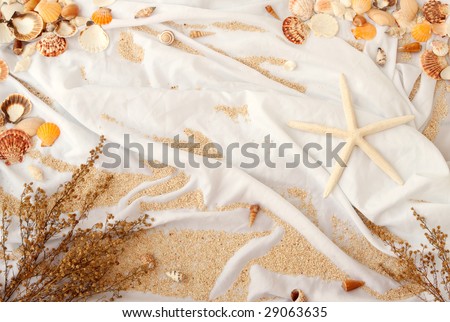 Background of beach scene on white wrinkled fabric (With shell border on top)