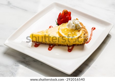Lemon pie with strawberry and cream