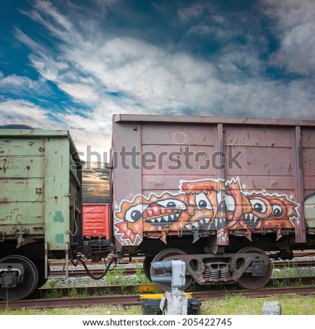 RIGA, LATVIA - JUNE 24: Railroad car with illegal graffiti at sunset on June 24, 2014 in Riga, Latvia