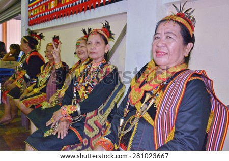 SABAH, MALAYSIA - MAY 24, 2015 : A group of Dusun Lotud (Bobohizan) in traditional costume during Harvest Festival celebration May 24, 2015 in Tamparuli, Sabah Borneo, Malaysia.