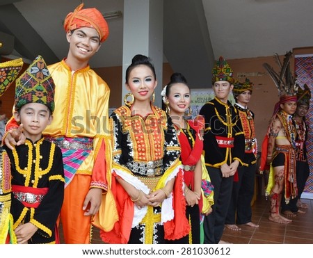 SABAH, MALAYSIA - MAY 24, 2015 : Kadazan Dusun Tuaran people in traditional costume during Harvest Festival celebration May 24, 2012 in Tamparuli, Sabah, Malaysia.